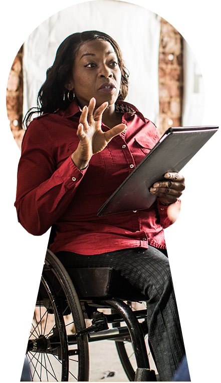African American woman in a wheelchair holding a tablet, sharing her ideas