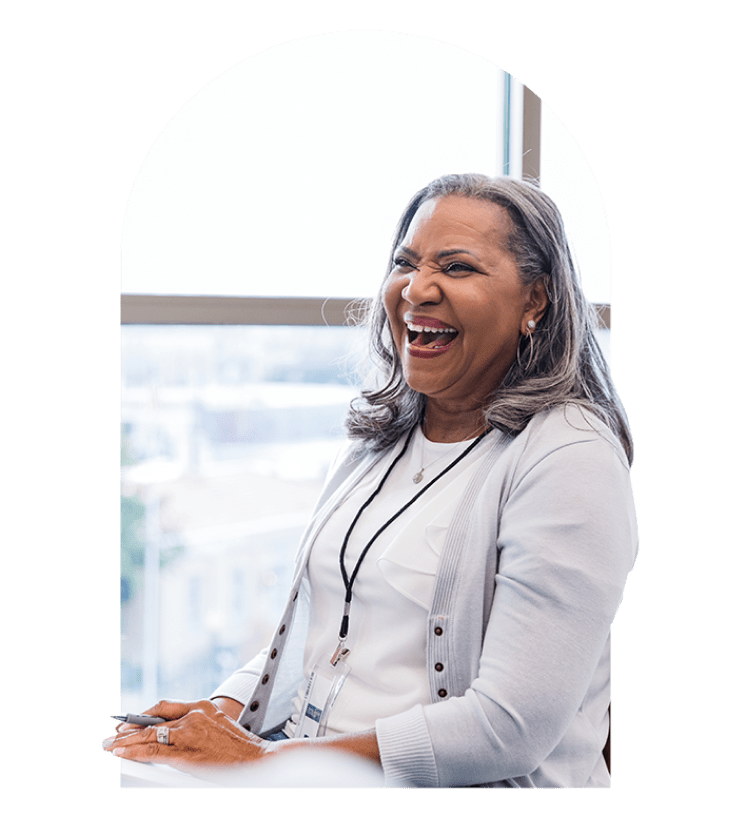 Smiling woman sitting at desk