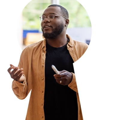 African American man holding marker and presenting ideas