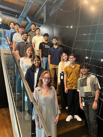 Interns standing on a staircase